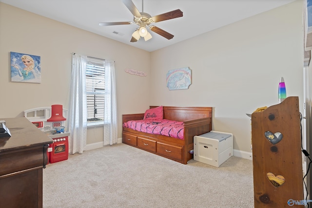 bedroom featuring light colored carpet and ceiling fan