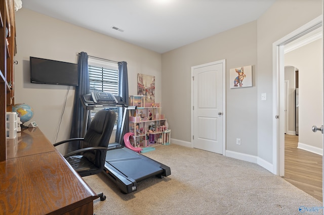 home office with light carpet