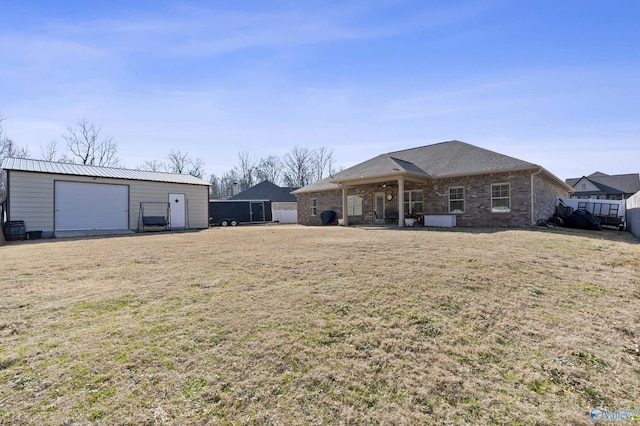 exterior space featuring an outbuilding and a garage