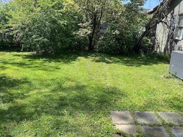 1022 Stevens Ave NE, Huntsville, AL 35801 - view of green lawn with central AC unit