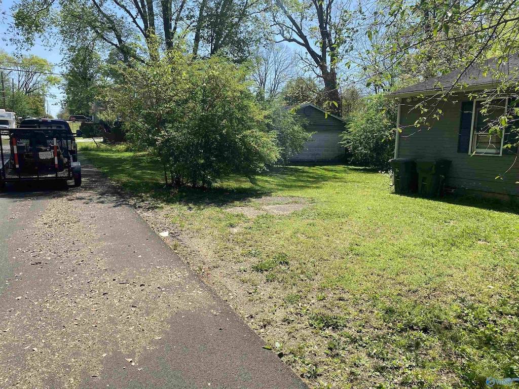 1022 Stevens Ave NE, Huntsville, AL 35801 - view of green lawn with asphalt driveway