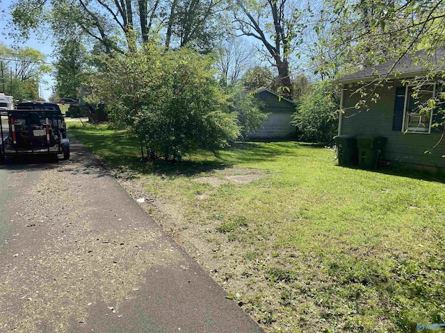 1022 Stevens Ave NE, Huntsville, AL 35801 - view of green lawn with asphalt driveway