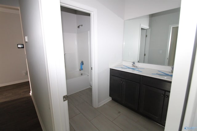 full bathroom featuring vanity, toilet, and washtub / shower combination