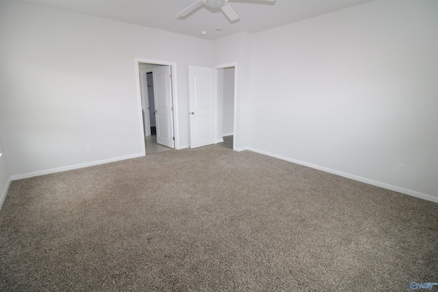 spare room with carpet and ceiling fan