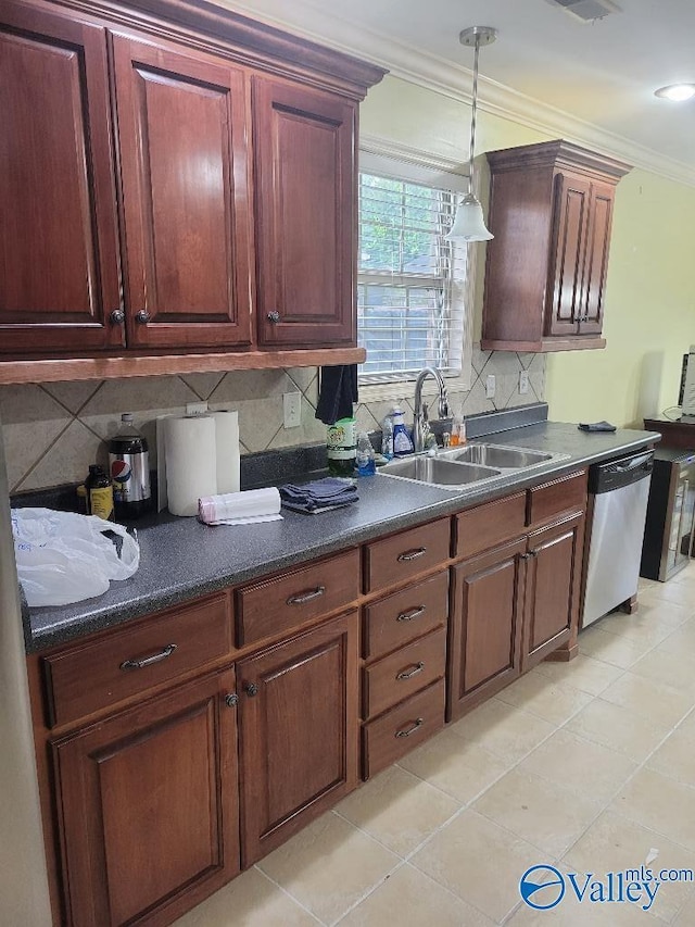 kitchen featuring tasteful backsplash, dishwasher, ornamental molding, pendant lighting, and a sink