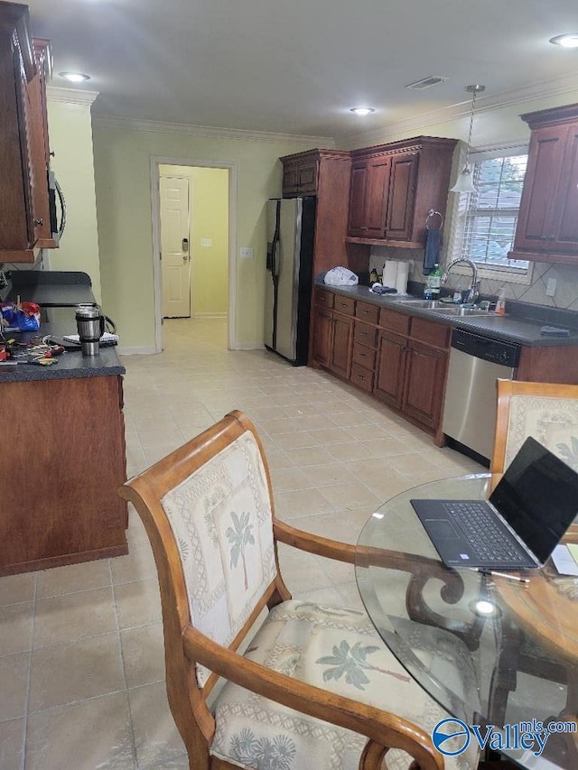 kitchen featuring crown molding, decorative backsplash, fridge with ice dispenser, a sink, and dishwasher