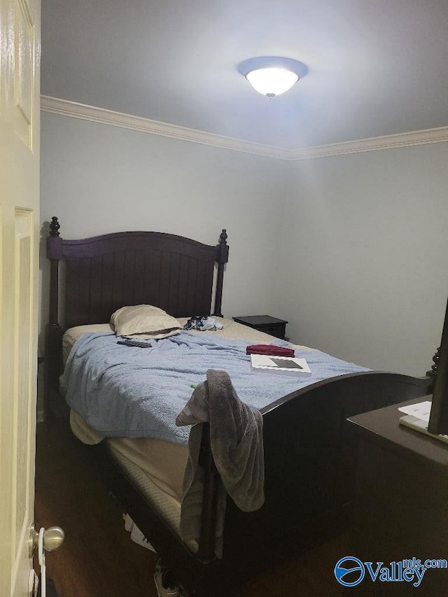 bedroom featuring crown molding