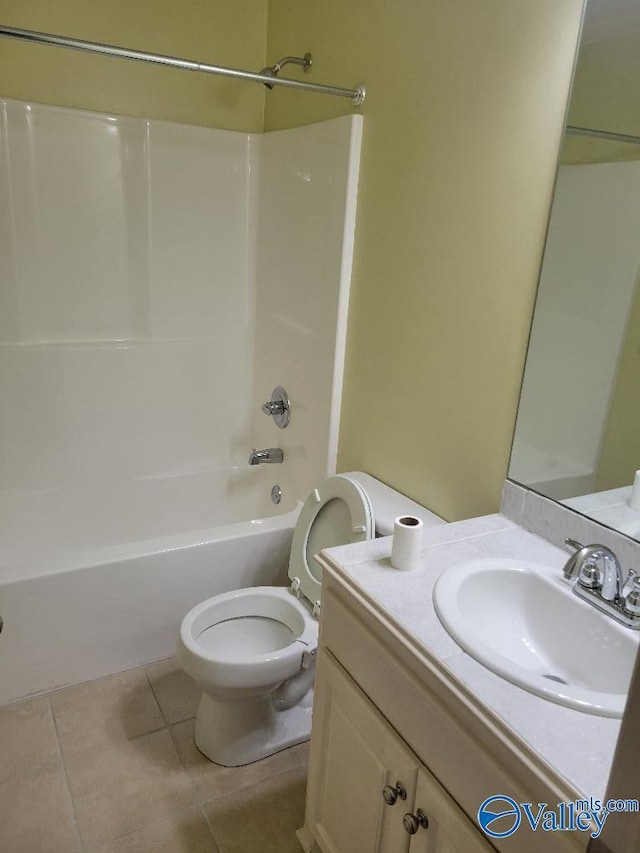 bathroom with shower / bathing tub combination, vanity, toilet, and tile patterned floors