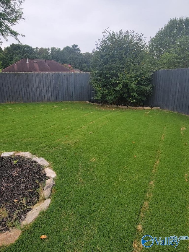 view of yard featuring a fenced backyard