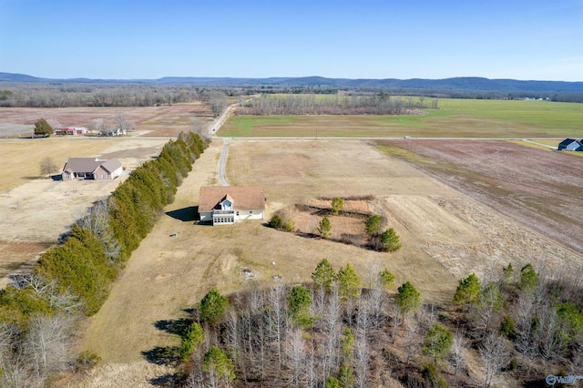 drone / aerial view featuring a mountain view and a rural view