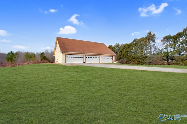 view of front of house with a garage and a front yard