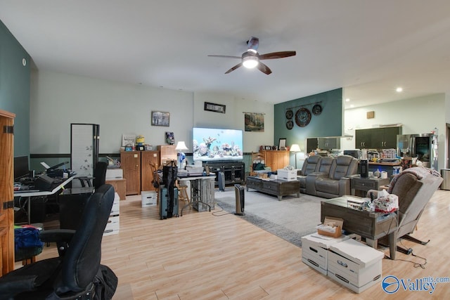 living room with ceiling fan and light hardwood / wood-style floors