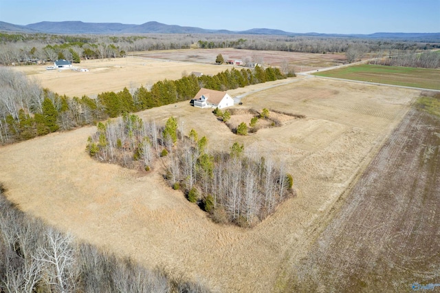 drone / aerial view with a mountain view and a rural view