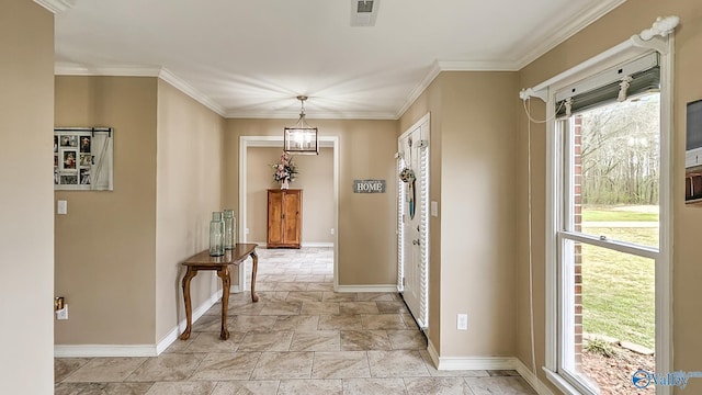 interior space with baseboards, visible vents, and crown molding