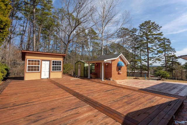 wooden deck featuring an outdoor structure