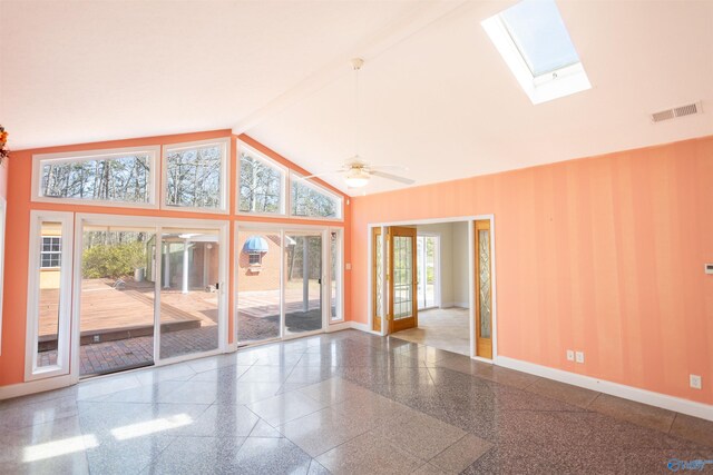 unfurnished living room with high vaulted ceiling, a skylight, ceiling fan, and beam ceiling