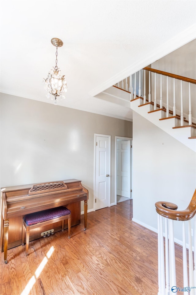 interior space with light hardwood / wood-style flooring and an inviting chandelier