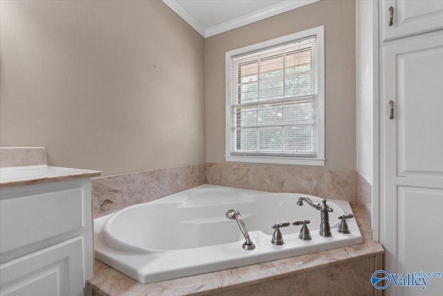 bathroom featuring vanity, crown molding, and tiled bath