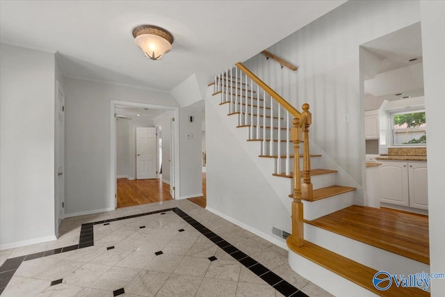 foyer entrance with crown molding