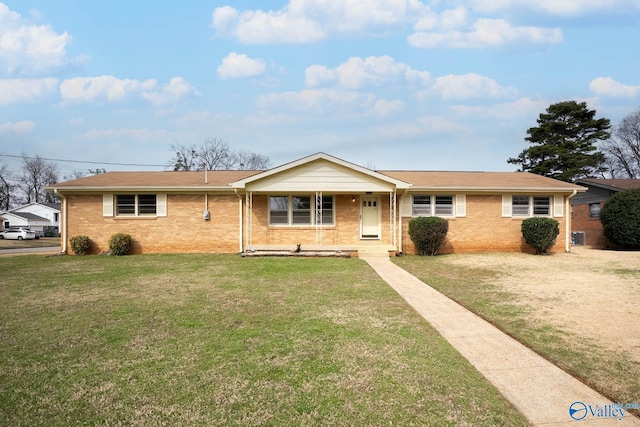 single story home with a front lawn, a porch, and brick siding