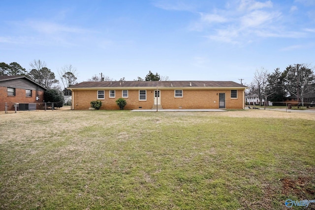 single story home featuring central air condition unit, brick siding, fence, crawl space, and a front yard