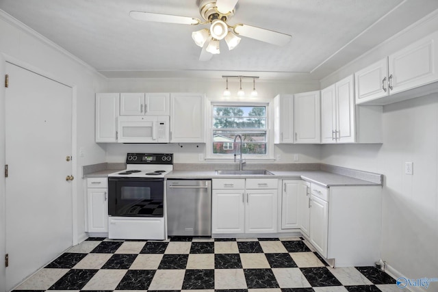 kitchen with white appliances, white cabinets, and light countertops