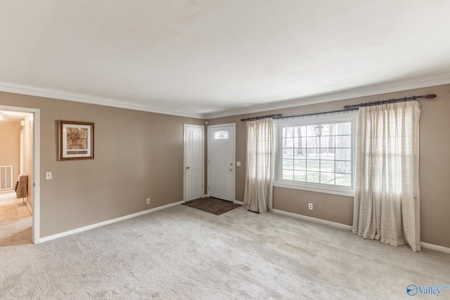 interior space featuring visible vents, crown molding, and baseboards