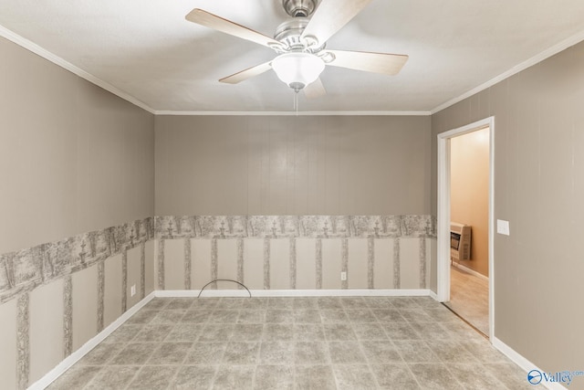 carpeted empty room featuring heating unit, a ceiling fan, and ornamental molding