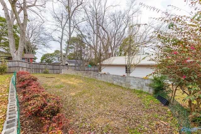 view of yard with a fenced backyard