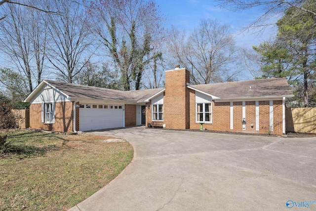 ranch-style house with driveway, fence, a garage, brick siding, and a chimney