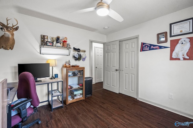 office area featuring baseboards, wood finished floors, a textured ceiling, and ceiling fan