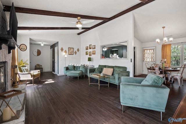 living area featuring ceiling fan with notable chandelier, lofted ceiling with beams, a fireplace, baseboards, and dark wood-style flooring