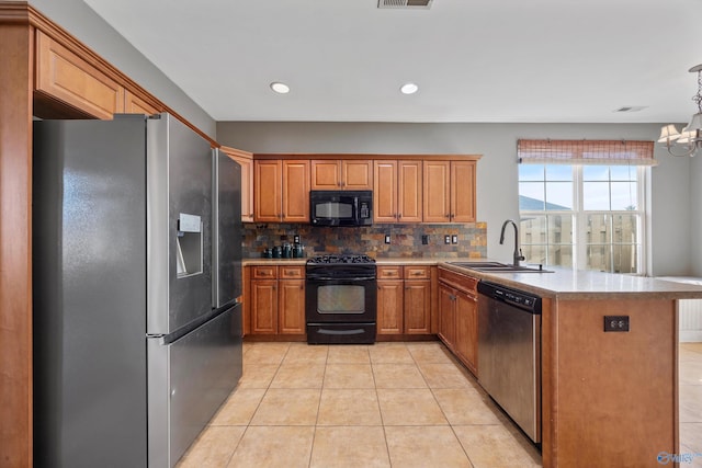 kitchen with sink, light tile patterned floors, tasteful backsplash, black appliances, and kitchen peninsula