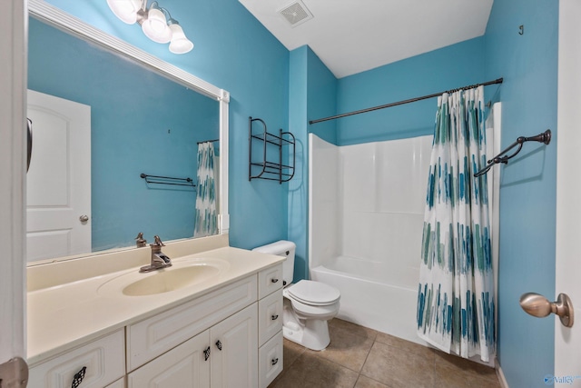 full bathroom featuring shower / tub combo with curtain, vanity, toilet, and tile patterned flooring