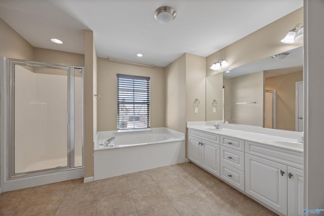 bathroom with tile patterned flooring, vanity, and separate shower and tub