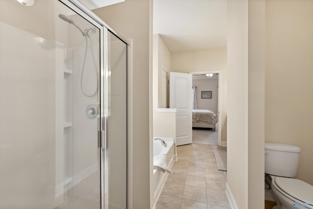 ensuite bathroom featuring tile patterned flooring, toilet, a garden tub, a stall shower, and ensuite bath