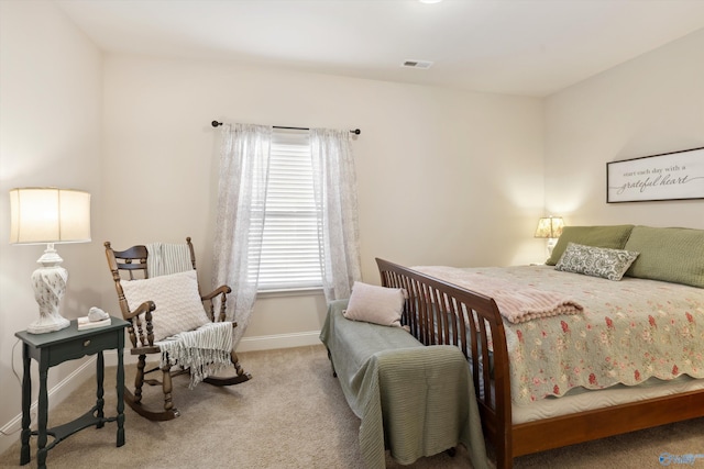 bedroom with visible vents, baseboards, and carpet floors