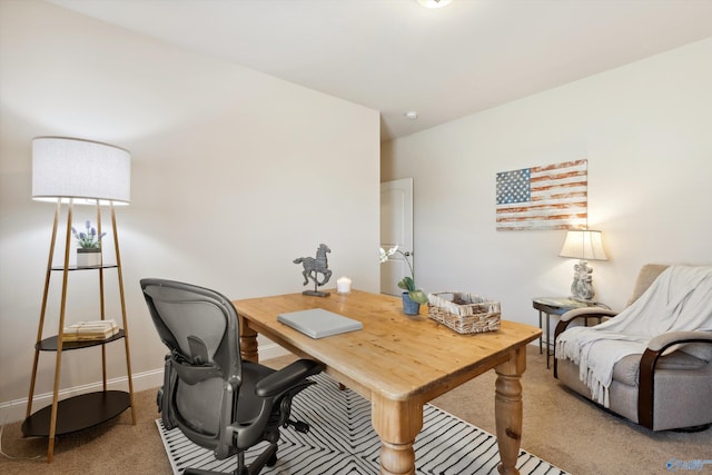 home office featuring baseboards and carpet floors