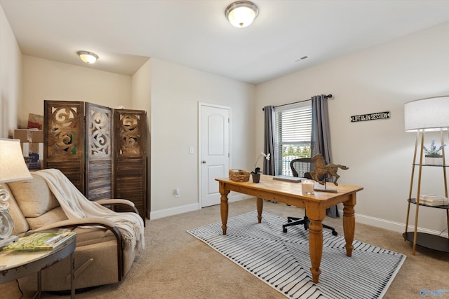 office space featuring visible vents, light carpet, and baseboards