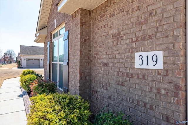 view of home's exterior with brick siding