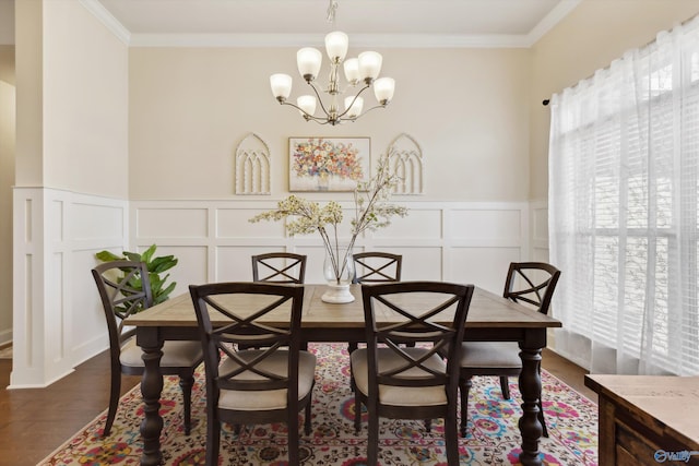 dining area with a wealth of natural light, a decorative wall, crown molding, and dark wood-type flooring