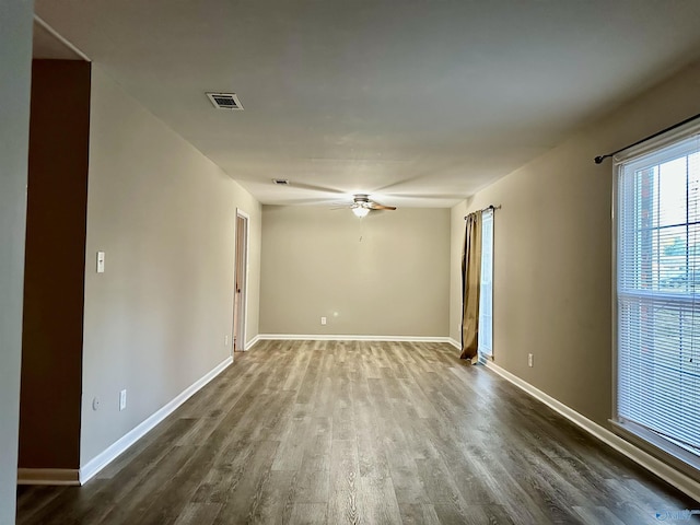 unfurnished room with ceiling fan and hardwood / wood-style flooring