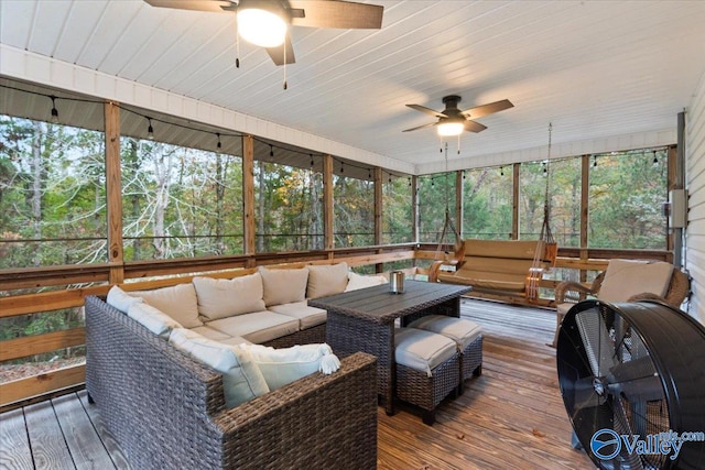 sunroom / solarium featuring ceiling fan and wood ceiling