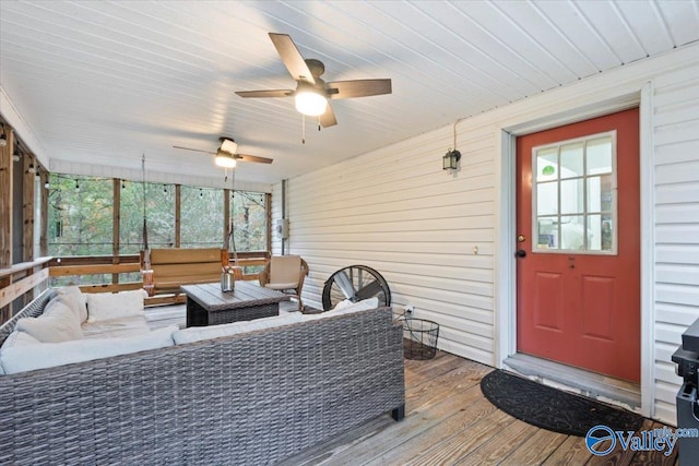 exterior space with a wealth of natural light and ceiling fan