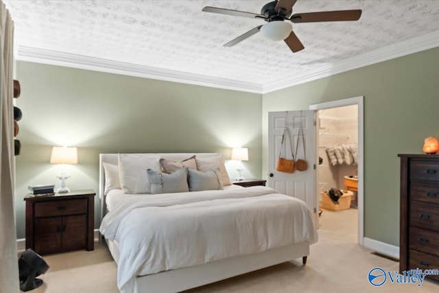 carpeted bedroom with ceiling fan, a textured ceiling, and ornamental molding