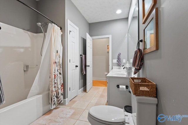 full bathroom with tile patterned floors, vanity, shower / bath combo, and toilet