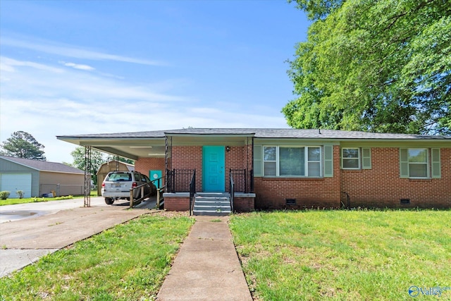 905 Cedar St SW, Decatur, AL 35601 - view of front of house with crawl space, concrete driveway, an attached carport, a front yard, and brick siding