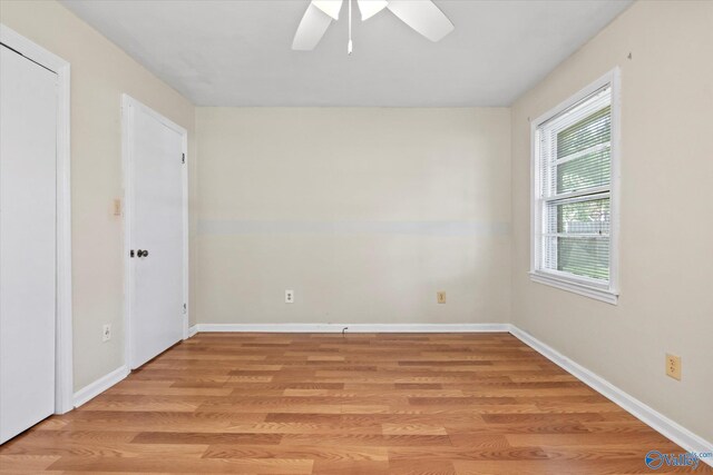 905 Cedar St SW, Decatur, AL 35601 - spare room featuring light wood-style floors, a ceiling fan, and baseboards
