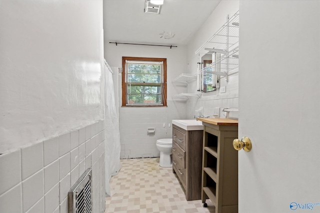 905 Cedar St SW, Decatur, AL 35601 - bathroom with tile walls, vanity, toilet, curtained shower, and wainscoting