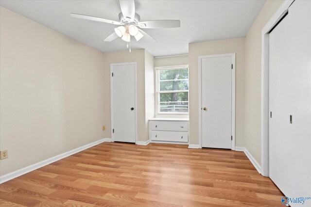 905 Cedar St SW, Decatur, AL 35601 - unfurnished bedroom featuring light wood-style flooring, baseboards, and a ceiling fan